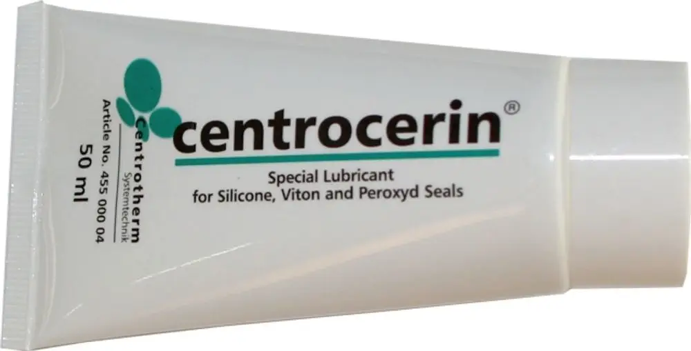 Weiße Tube mit Aufschrift „centrocerin“, die als spezielles Gleitmittel für Silikon-, Viton- und Peroxyd-Dichtungen dient. Marke: Wolf.